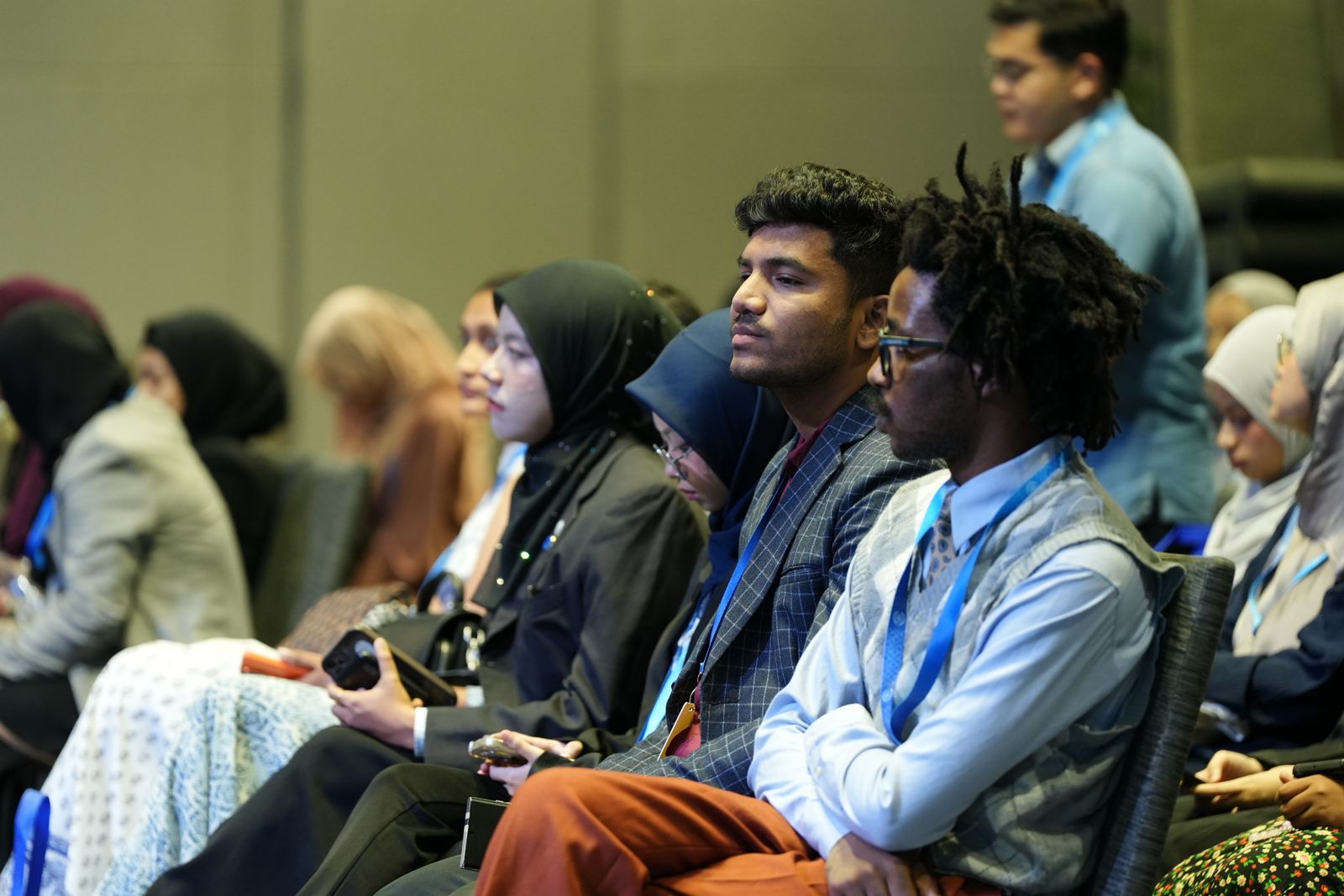 A multicultural audience at a professional event