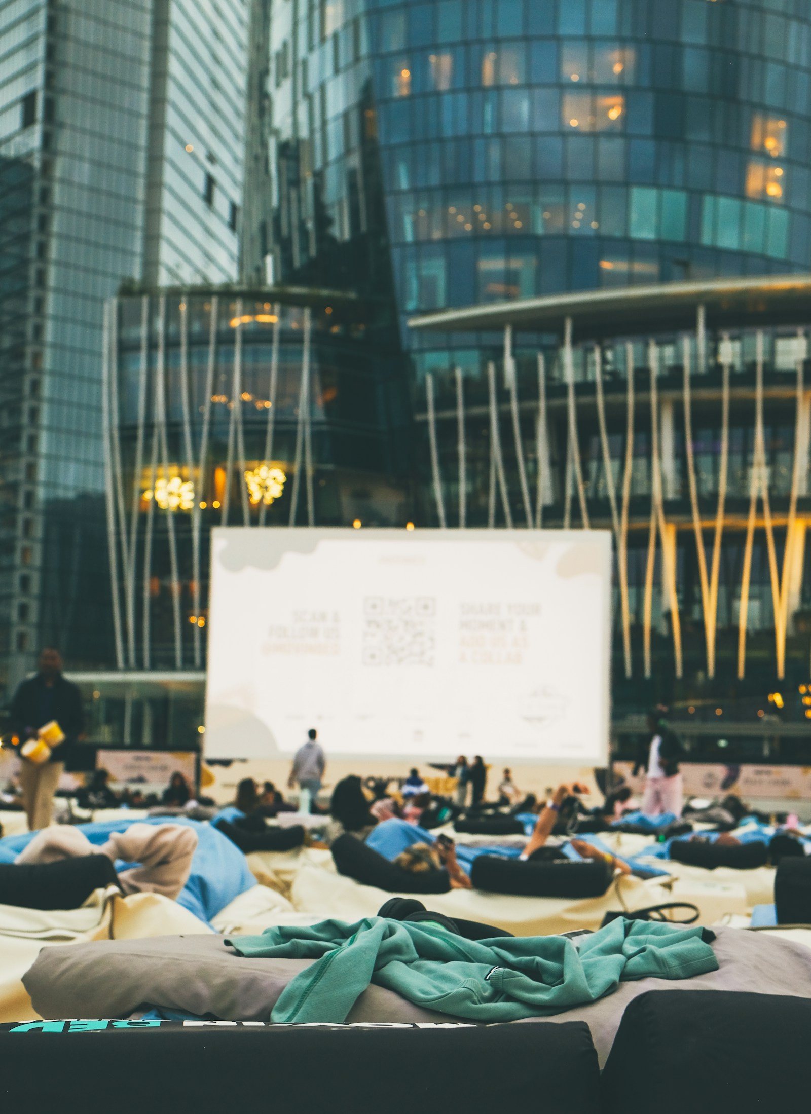Guests watching a film at a contemporary outdoor cinema