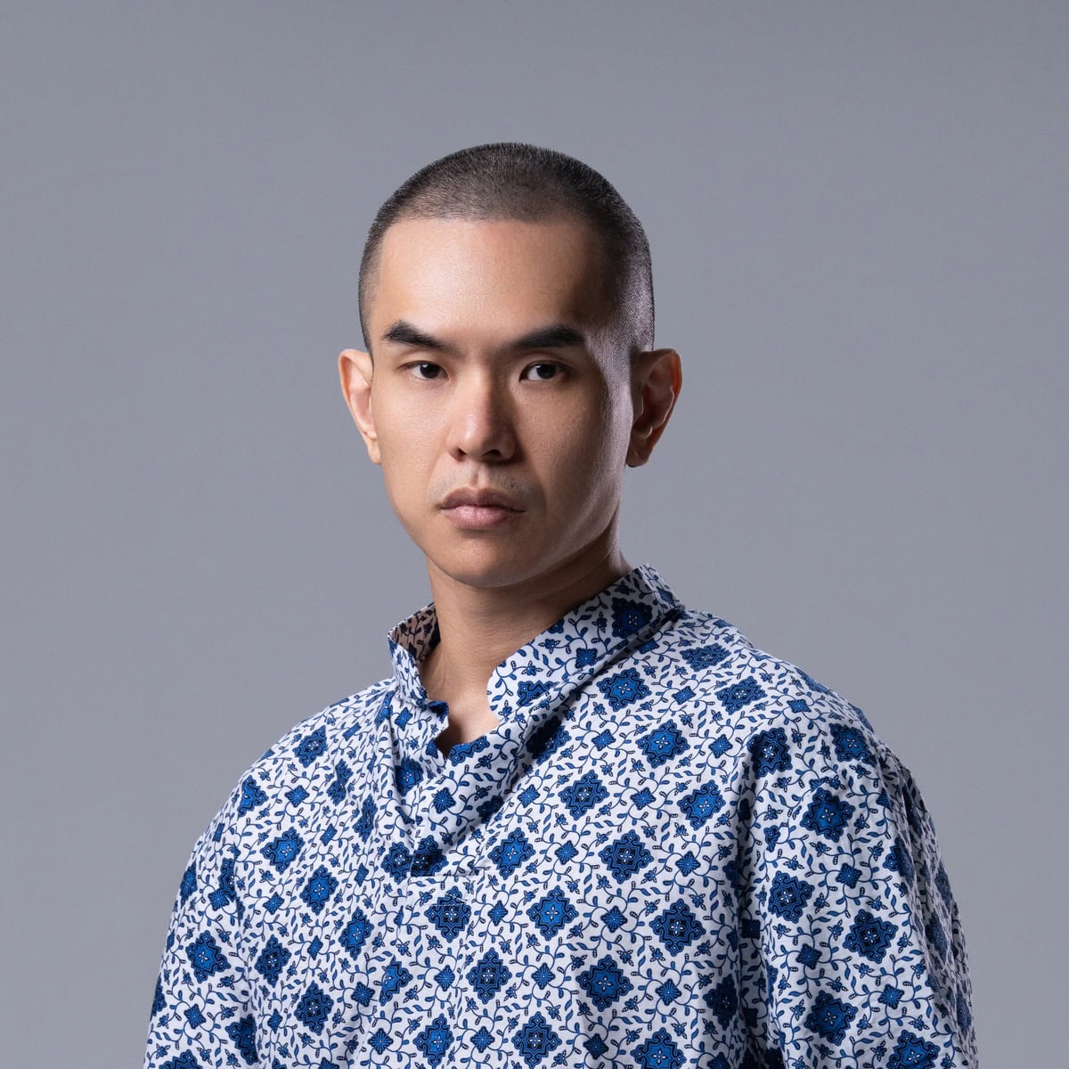 Dave T wearing a blue patterned shirt