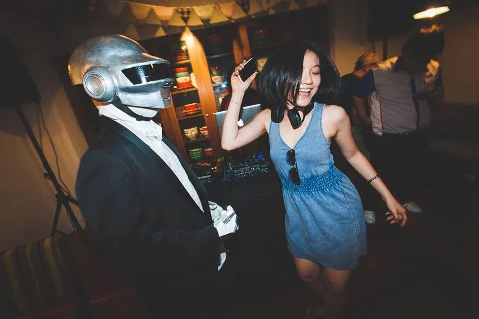 Guests dancing and posing during the listening event