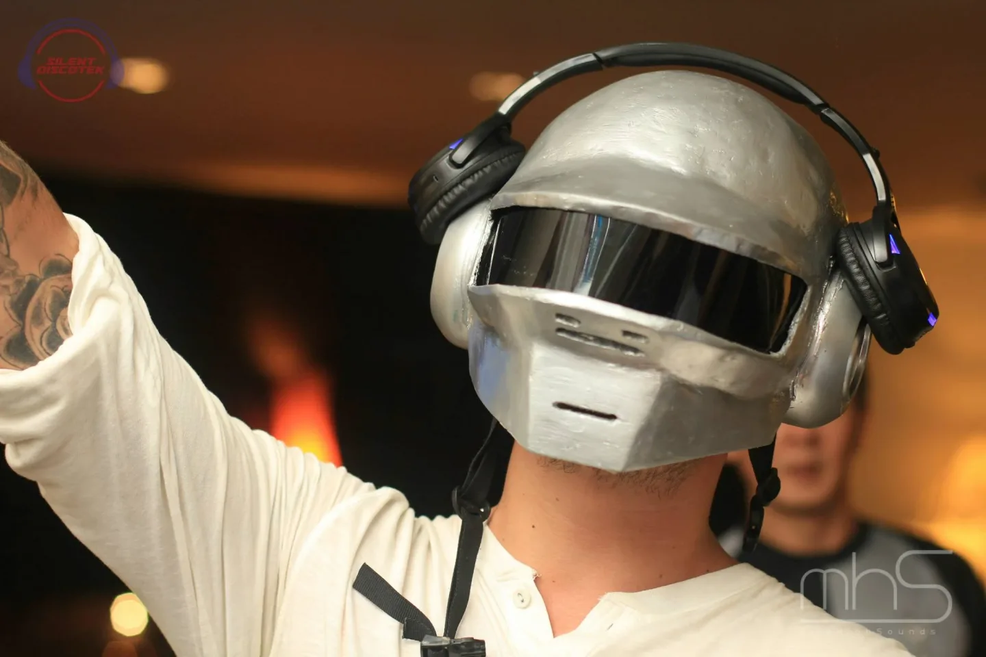 A helmeted guest using wireless headphones at the Livescape event