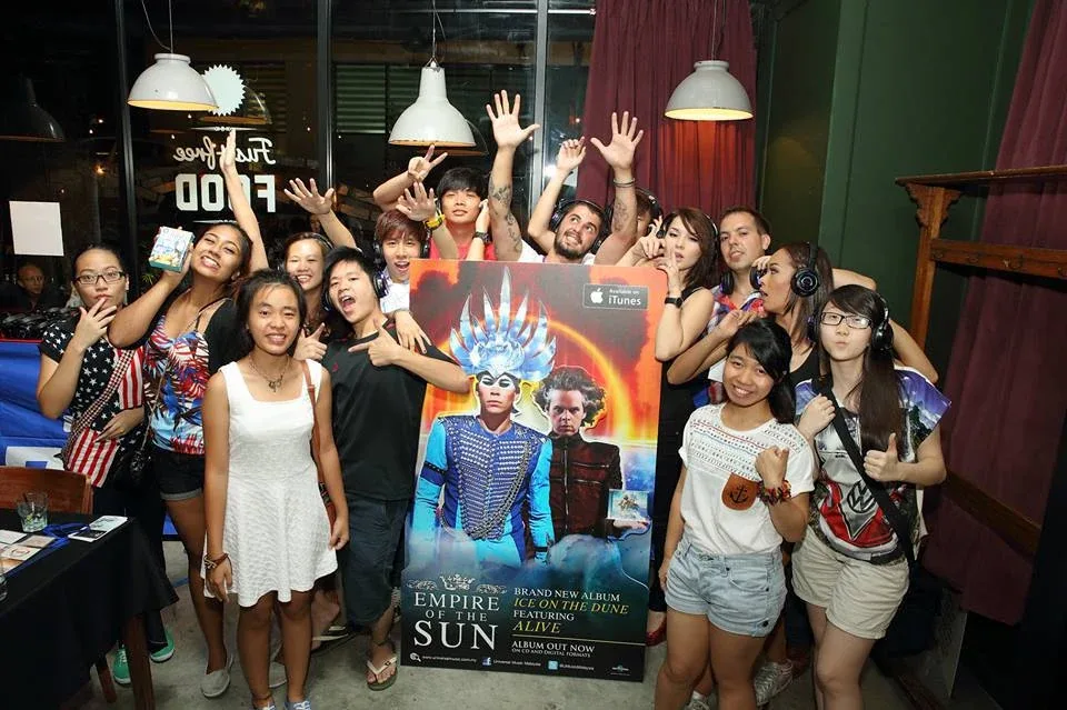 Group gathered around the album launch display
