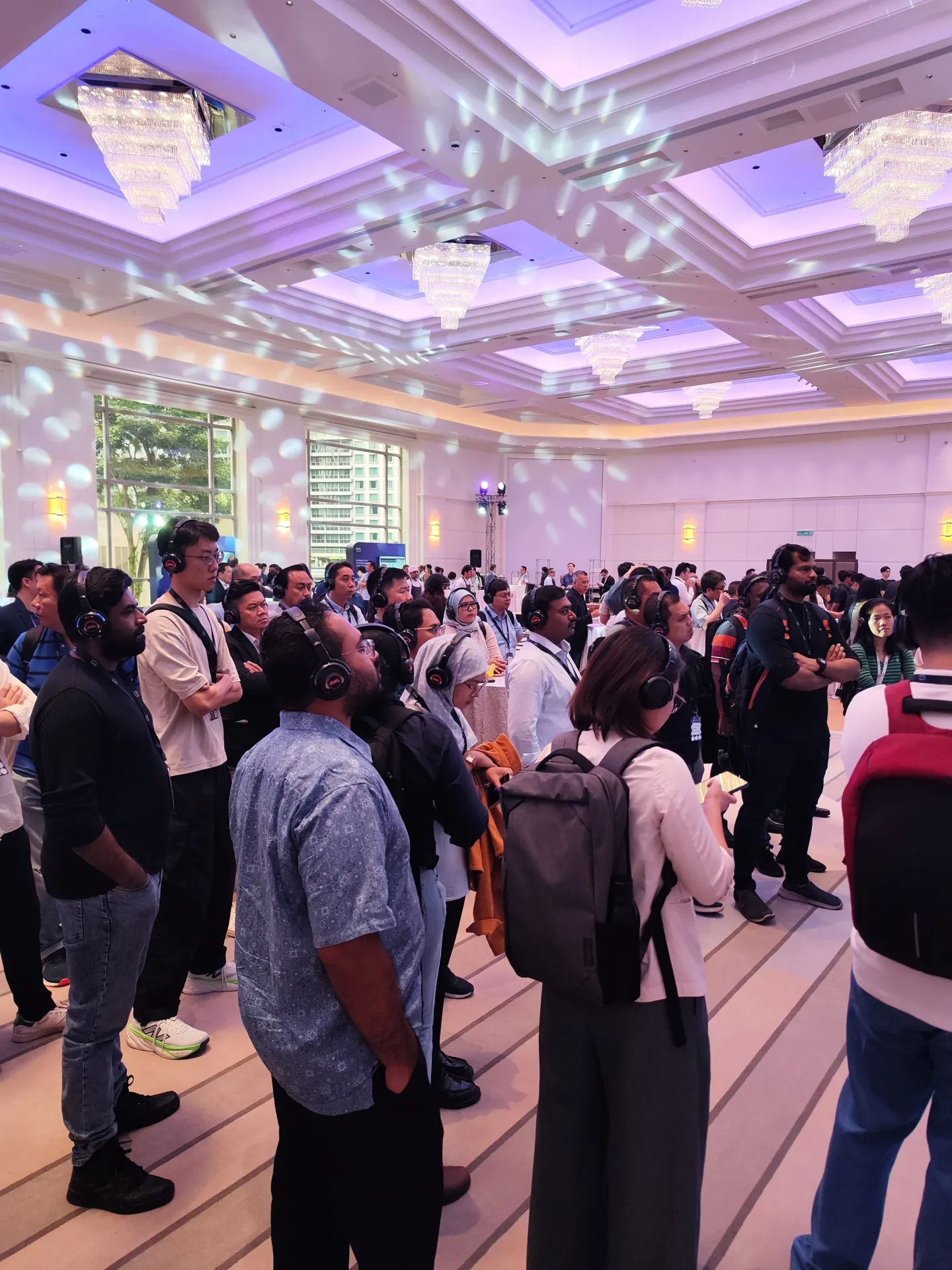 Guests listening through headphones during an exhibition activation