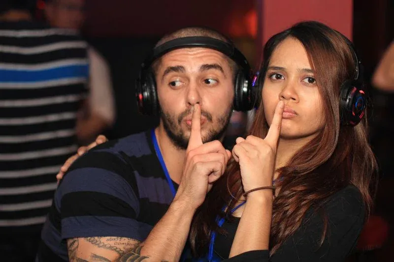 Guests wearing headphones at the Havana sneak demo
