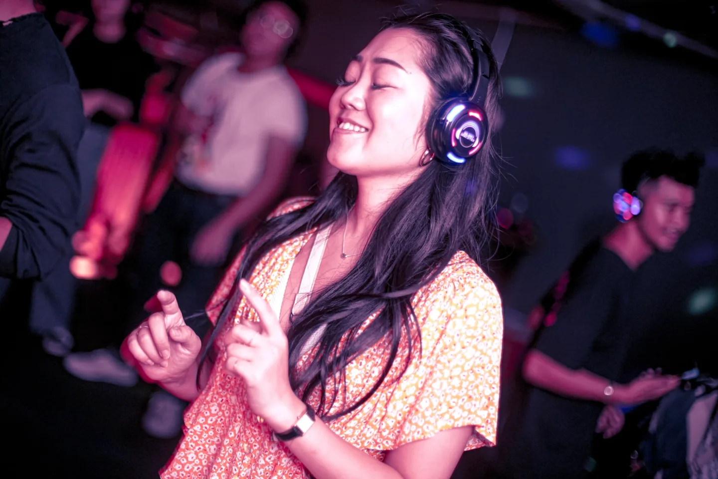 A guest enjoying the music through headphones at RIUH
