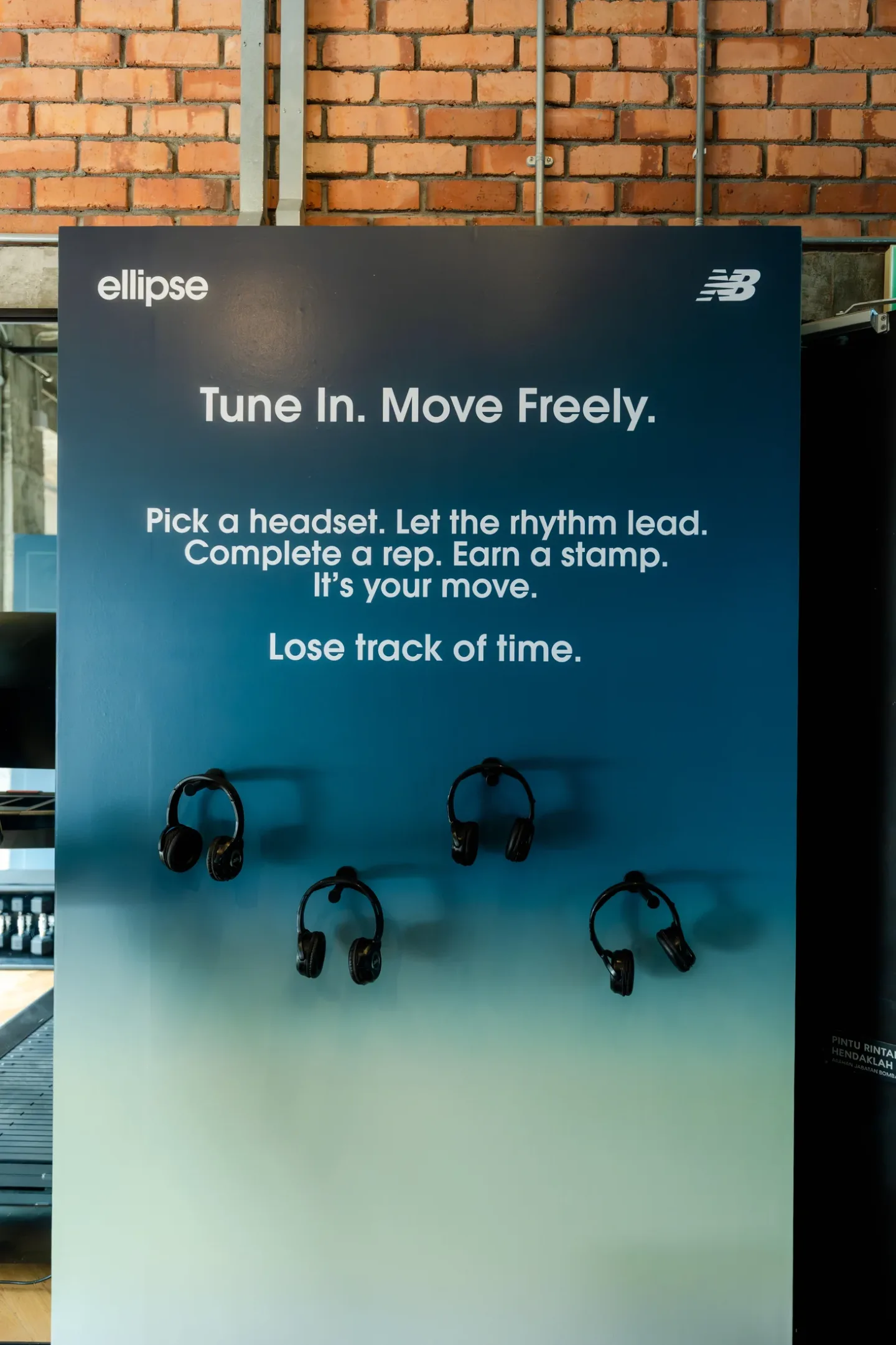 Wireless headphones ready at the New Balance Ellipse Tune In and Move station