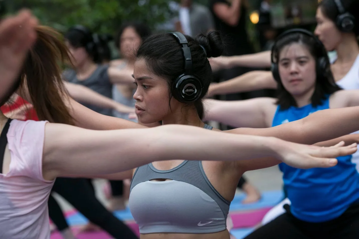 A participant following the guided silent yoga session