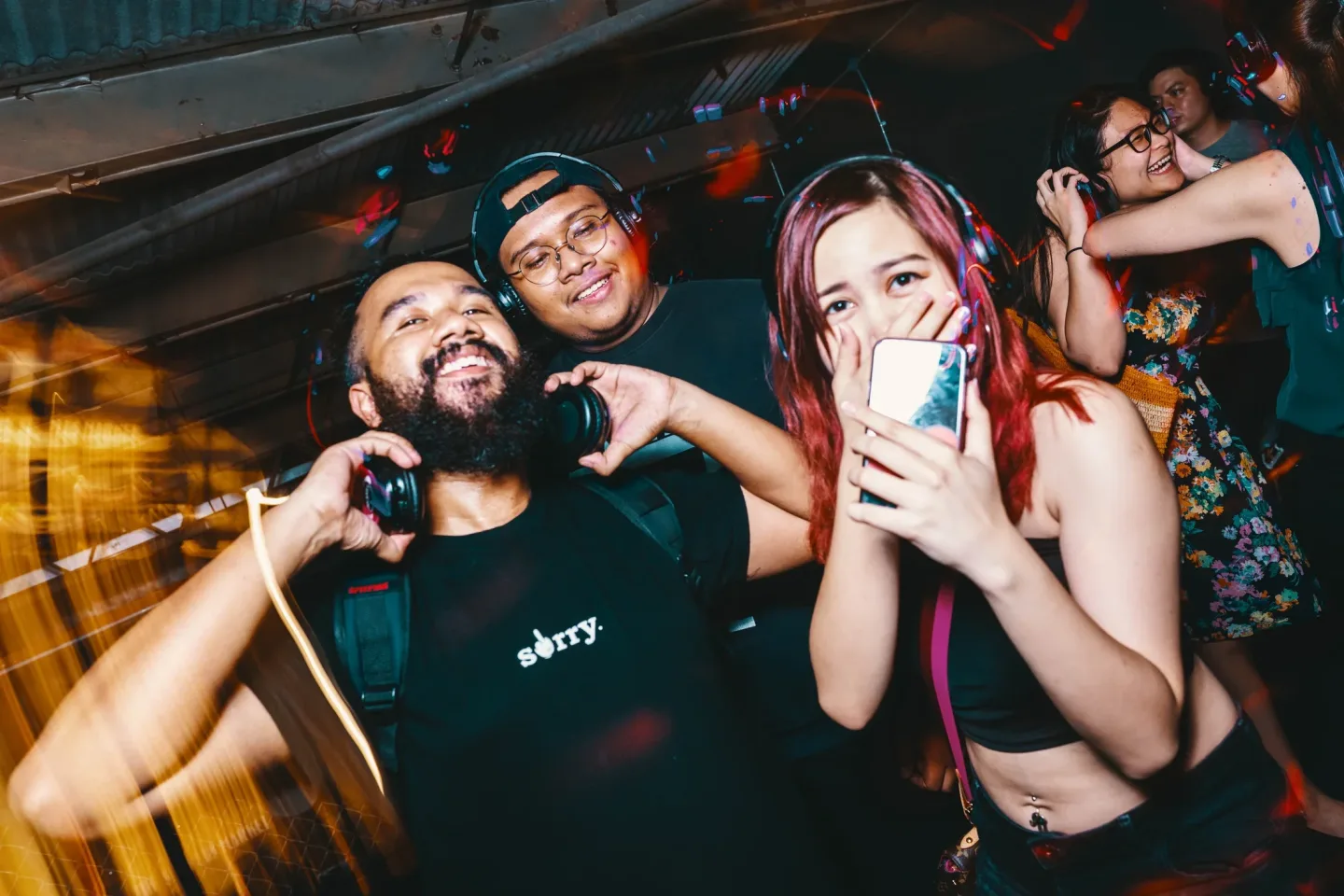 Friends celebrating together at a Silent Discotek event