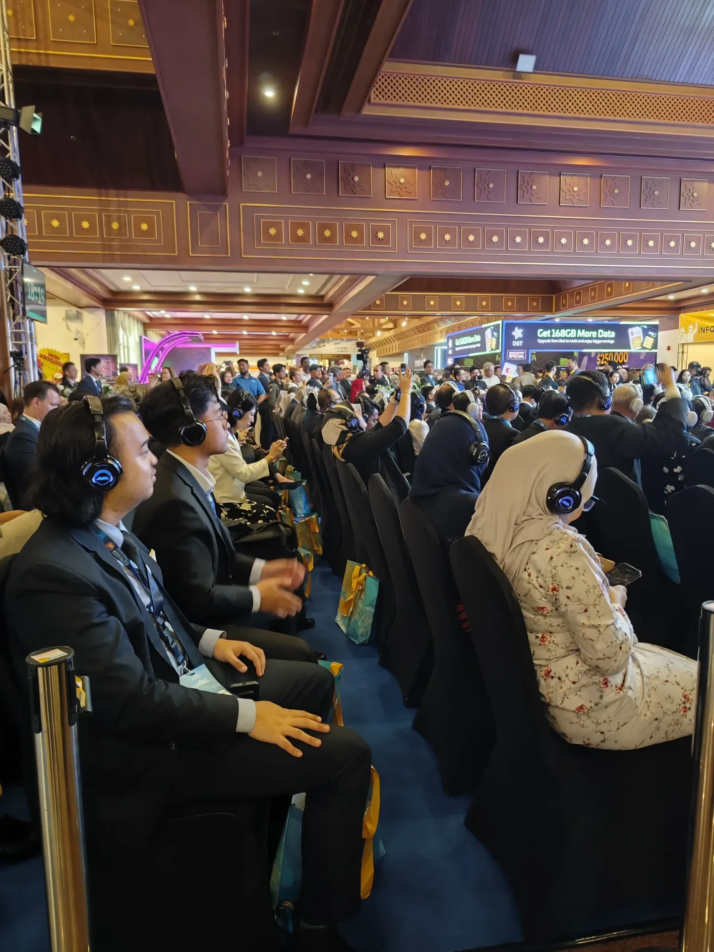 Corporate event guests in Malaysia listening through Silent Discotek wireless headphones