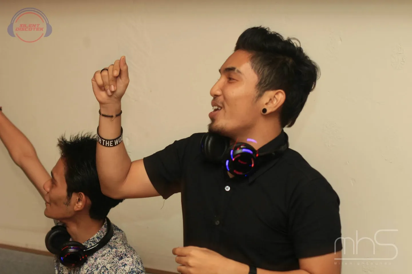A guest dancing with headphones at the Livescape event
