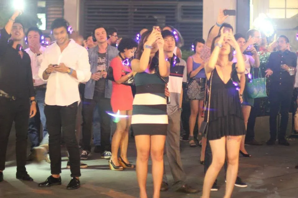 Guests dancing at the Merdeka Eve headphone party