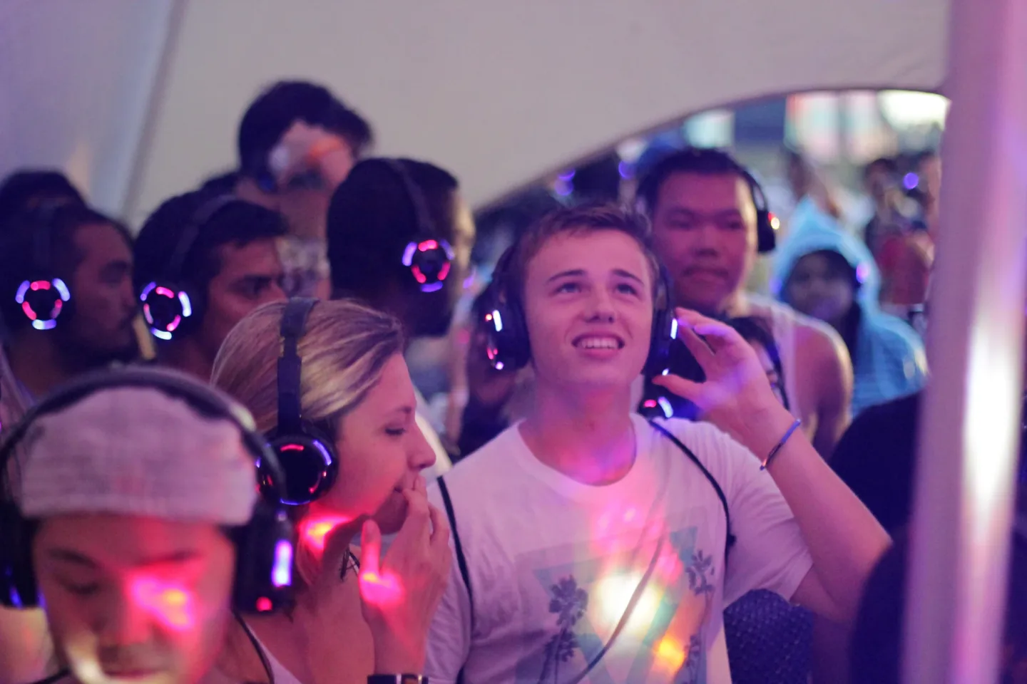 Festival guests listening through Silent Discotek headphones