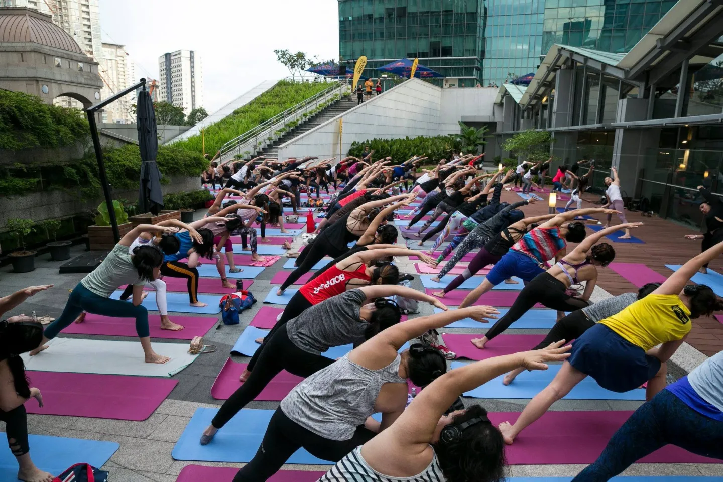 Silent yoga participants stretching together at DC Mall