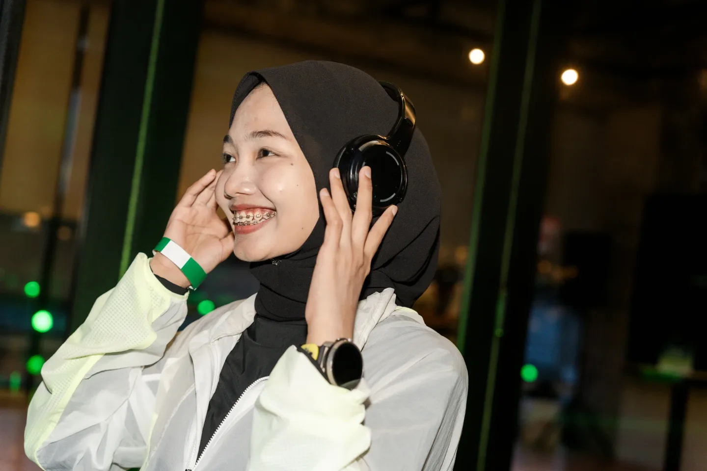 Guest trying wireless headphones at the New Balance Ellipse activation