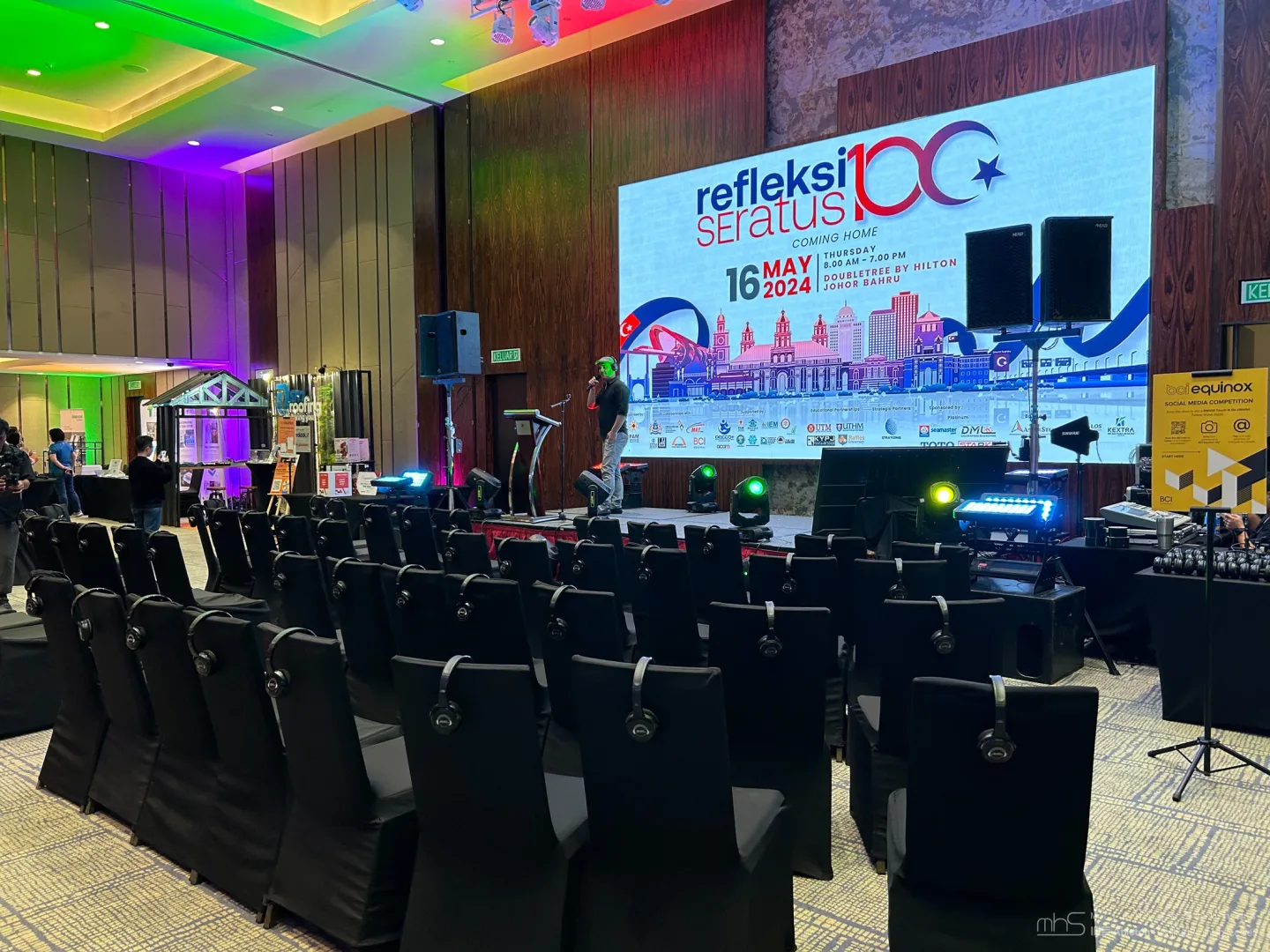 Rows of headphones laid out before the Johor conference