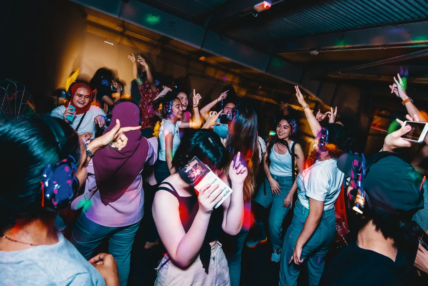 Guests dancing in wireless headphones at RIUH, Gasket Alley
