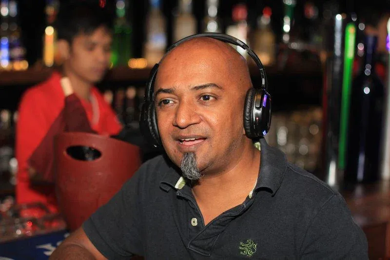 A guest trying headphones at the Havana sneak demo