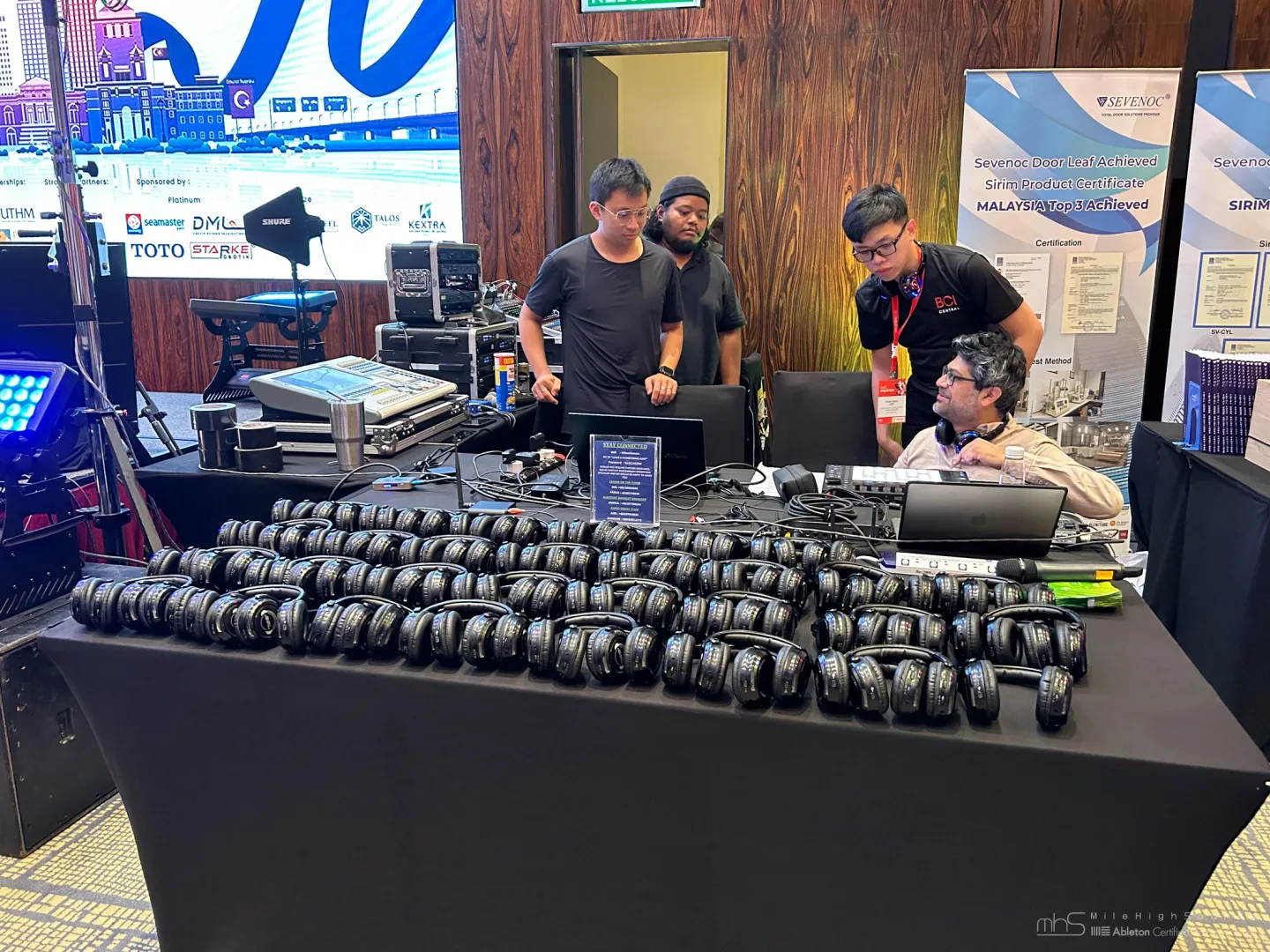 Technical crew and headphones prepared at the Johor conference